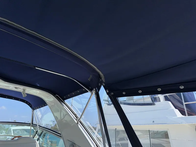 Slide: The Image of 1998 Bayliner 4085 Avanti Sunbridge boat canopy and interior view. - 10