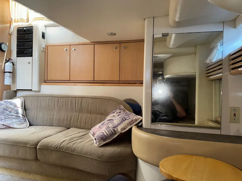 Slide: The Image of Interior of 1998 Bayliner 4085 Avanti Sunbridge with beige sofa and wooden cabinets. - 20