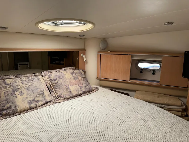 Slide: The Image of Interior cabin of 1998 Bayliner 4085 Avanti Sunbridge with bed and porthole window. - 23