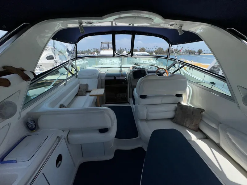 Slide: The Image of Interior of 1998 Bayliner 4085 Avanti Sunbridge yacht with white seating and blue accents. - 37
