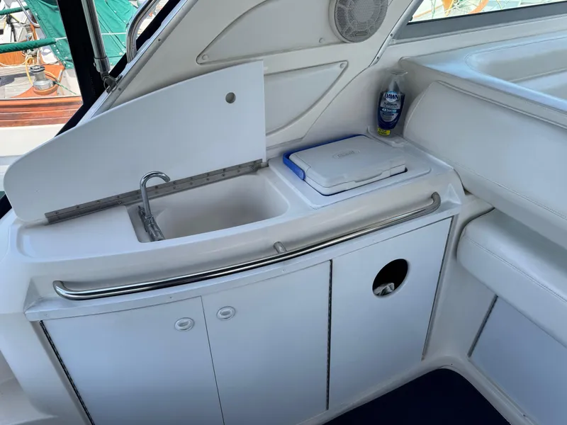 Slide: The Image of 1998 Bayliner 4085 Avanti Sunbridge boat interior with sink and storage area. - 7