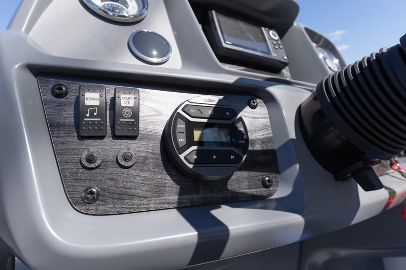 Slide: The Image of Control panel of 2026 Starcraft GX 20 R DH boat with stereo and light switches. - 11
