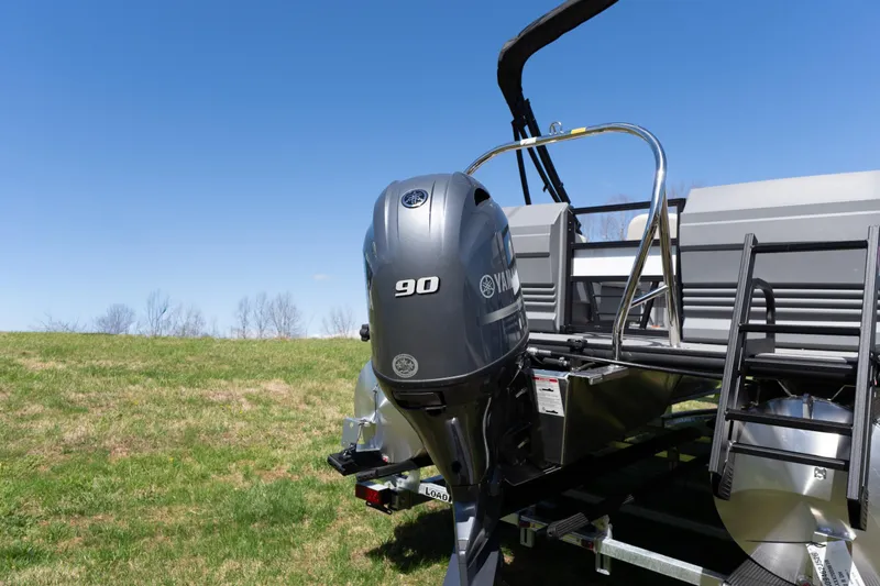 Slide: The Image of 2026 Starcraft GX 20 R DH boat with Yamaha 90 engine on grassy field. - 2