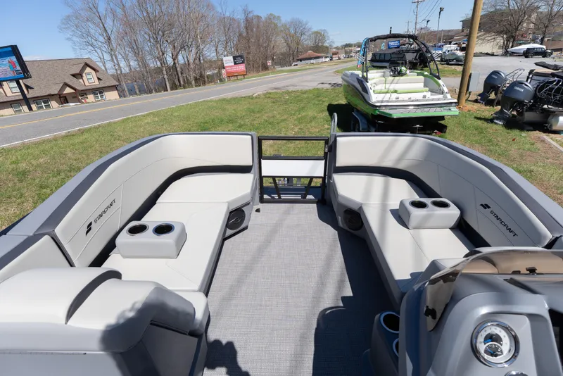 Slide: The Image of 2026 Starcraft GX 20 R DH boat interior with spacious seating and cup holders. - 6