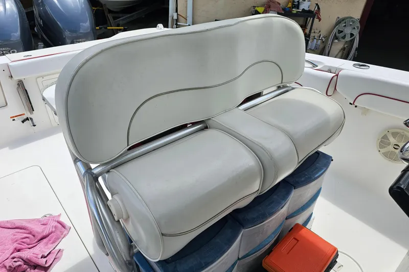 Slide: The Image of 2007 Wellcraft 30 Scarab Tournament boat interior with white seating and red accents. - 15