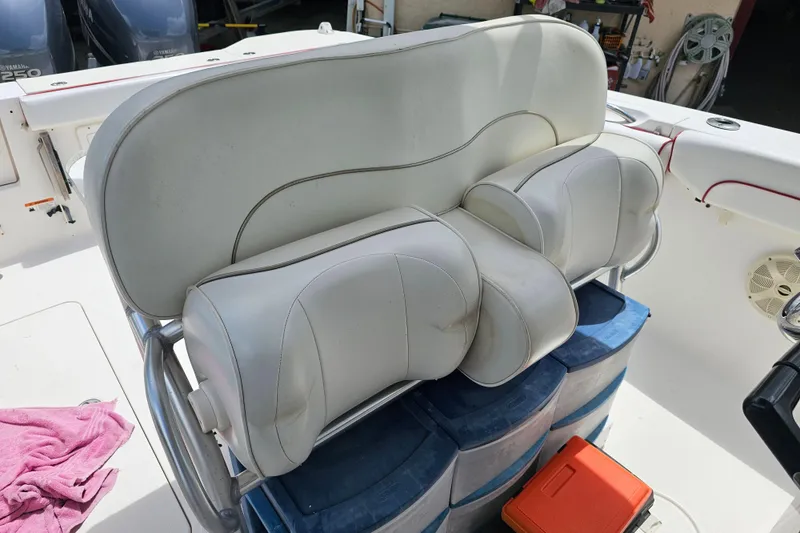 Slide: The Image of 2007 Wellcraft 30 Scarab Tournament boat interior with white seating and red trim. - 16