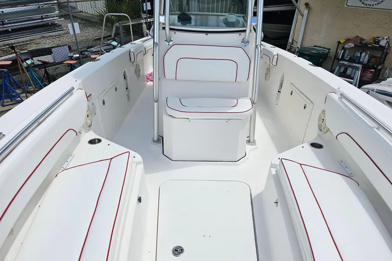 Slide: The Image of 2007 Wellcraft 30 Scarab Tournament boat interior with dual Yamaha engines and cushioned seating. - 22