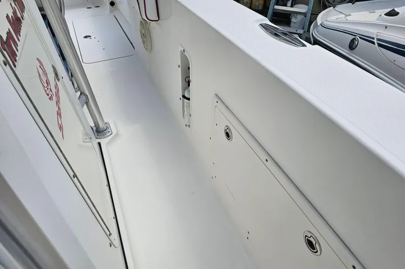 Slide: The Image of 2007 Wellcraft 30 Scarab Tournament boat dashboard with Raymarine electronics and communication equipment. - 24