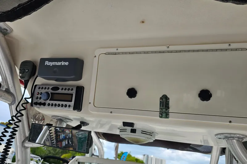 Slide: The Image of Control panel of 2007 Wellcraft 30 Scarab Tournament with Raymarine and Garmin displays. - 26