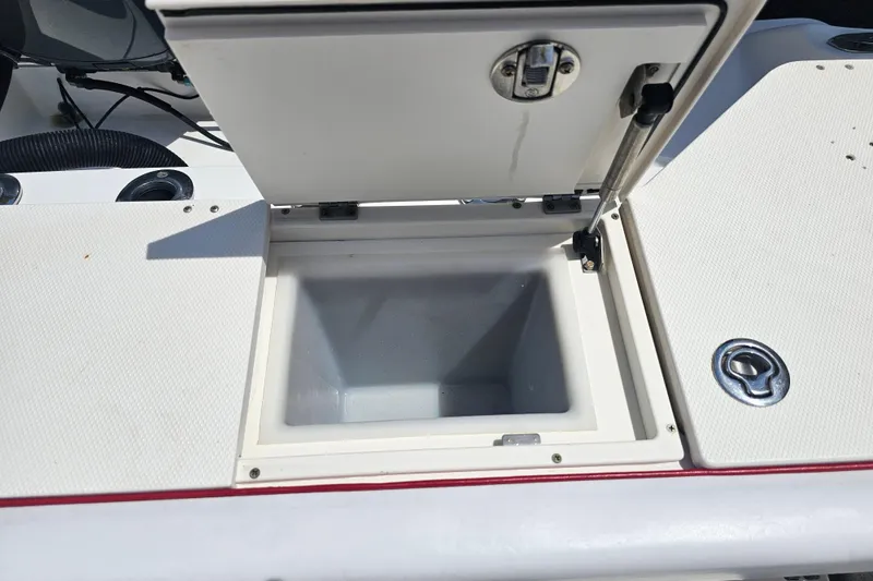 Slide: The Image of Open storage compartment on a 2007 Wellcraft 30 Scarab Tournament boat. - 29