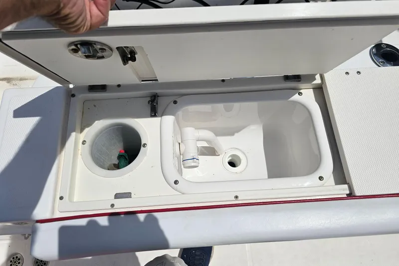 Slide: The Image of Open storage compartment on 2007 Wellcraft 30 Scarab Tournament boat deck. - 30