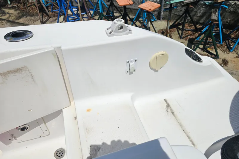 Slide: The Image of 2007 Wellcraft 30 Scarab Tournament boat deck with storage compartments and fittings. - 31