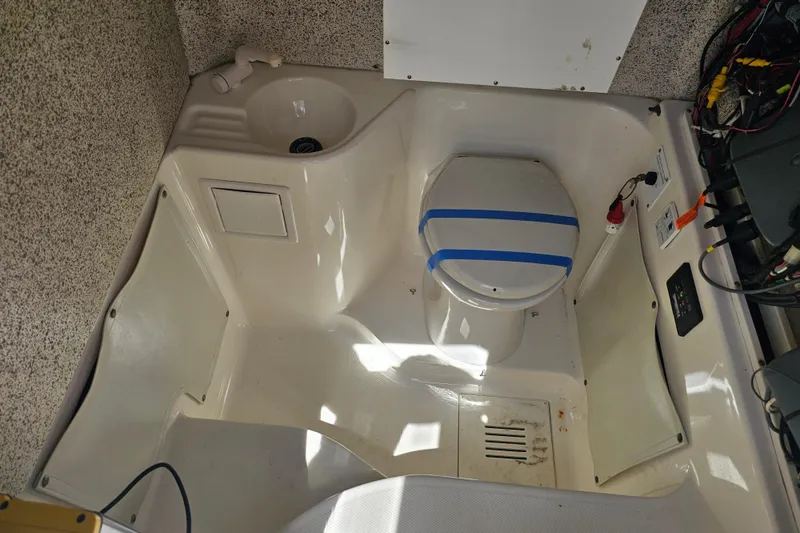 Slide: The Image of 2007 Wellcraft 30 Scarab Tournament boat interior with toilet and sink. - 32