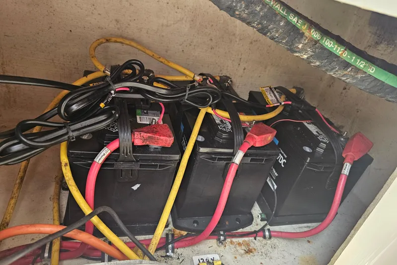 Slide: The Image of Batteries and cables in a 2007 Wellcraft 30 Scarab Tournament boat compartment. - 34