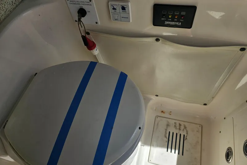 Slide: The Image of 2007 Wellcraft 30 Scarab Tournament boat interior with control panel and storage compartment. - 37