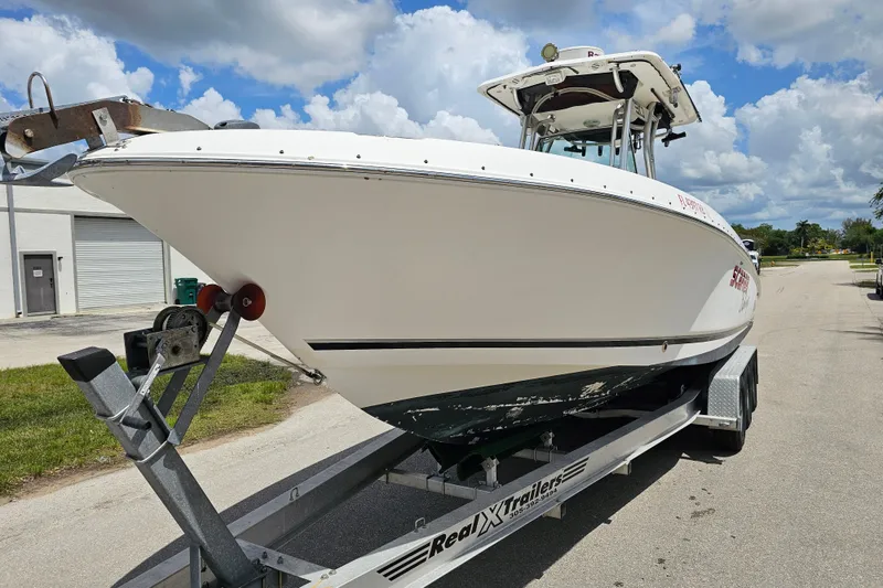 Slide: The Image of 2007 Wellcraft 30 Scarab Tournament boat deck with Yamaha 250 engines, featuring spacious seating. - 7