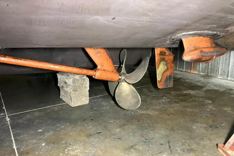 Slide: The Image of Propeller and rudder of a 2002 Sea Ray 410 Sundancer in dry dock. - 7