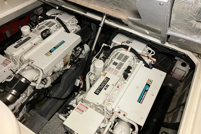 Slide: The Image of Engine compartment of a 2002 Sea Ray 410 Sundancer with dual Caterpillar engines. - 16