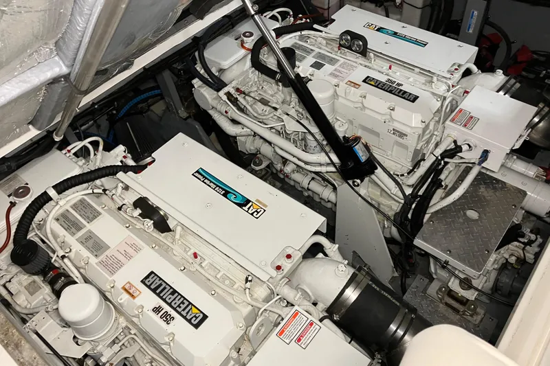 Slide: The Image of Engine room of 2002 Sea Ray 410 Sundancer with twin Caterpillar engines. - 17