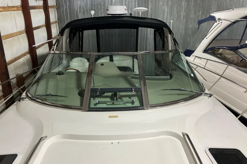 Slide: The Image of 2002 Sea Ray 410 Sundancer in a storage facility. - 29