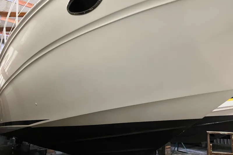Slide: The Image of 2002 Sea Ray 410 Sundancer boat hull in a storage facility. - 4