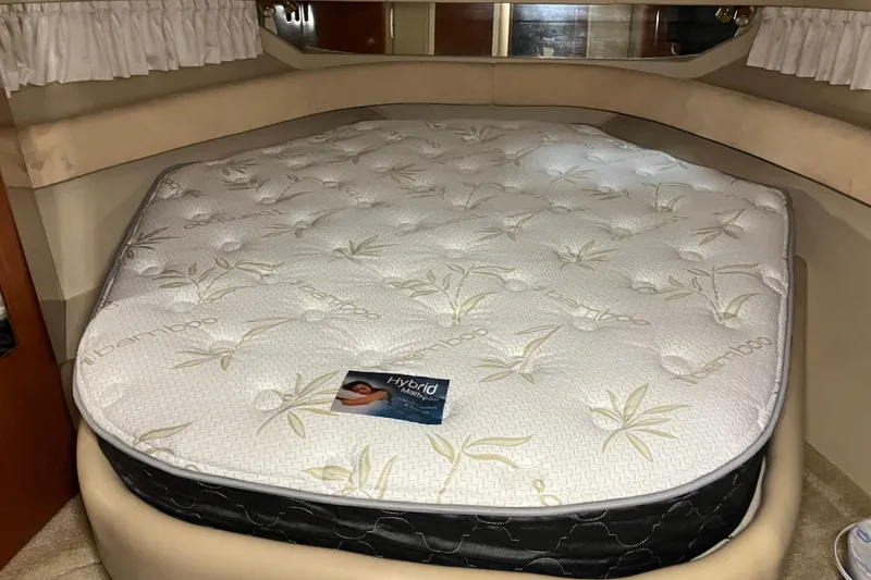 Slide: The Image of Interior of 2002 Sea Ray 410 Sundancer with bamboo-patterned mattress in cabin. - 21