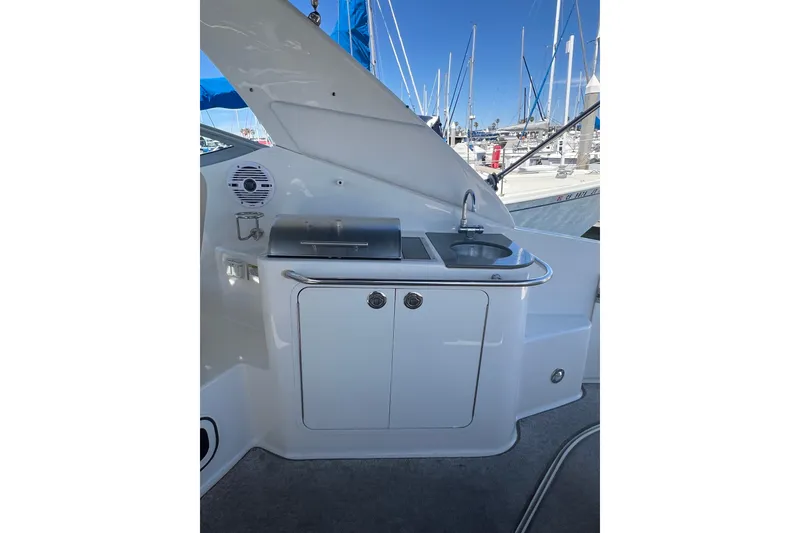 Slide: The Image of Outdoor kitchenette on 2013 Sea Ray Sundancer 280 yacht, featuring sink and grill. - 10