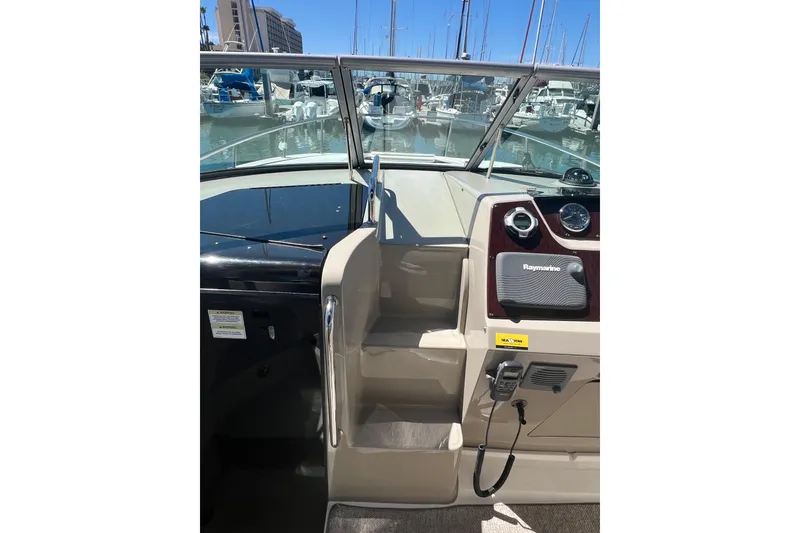 Slide: The Image of 2013 Sea Ray Sundancer 280 helm with Raymarine equipment, docked at marina. - 13
