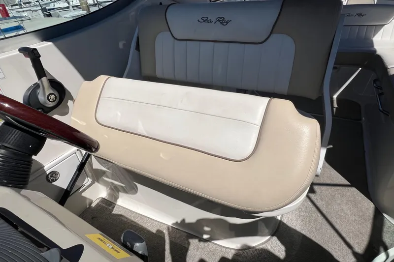 Slide: The Image of 2013 Sea Ray Sundancer 280 helm seat with steering wheel and controls. - 15