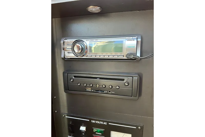 Slide: The Image of 2013 Sea Ray Sundancer 280 marine stereo system with control panel. - 22