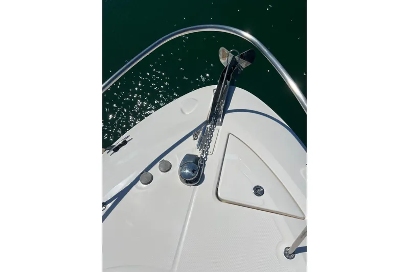Slide: The Image of Bow of 2013 Sea Ray Sundancer 280 with anchor and railing over water. - 5