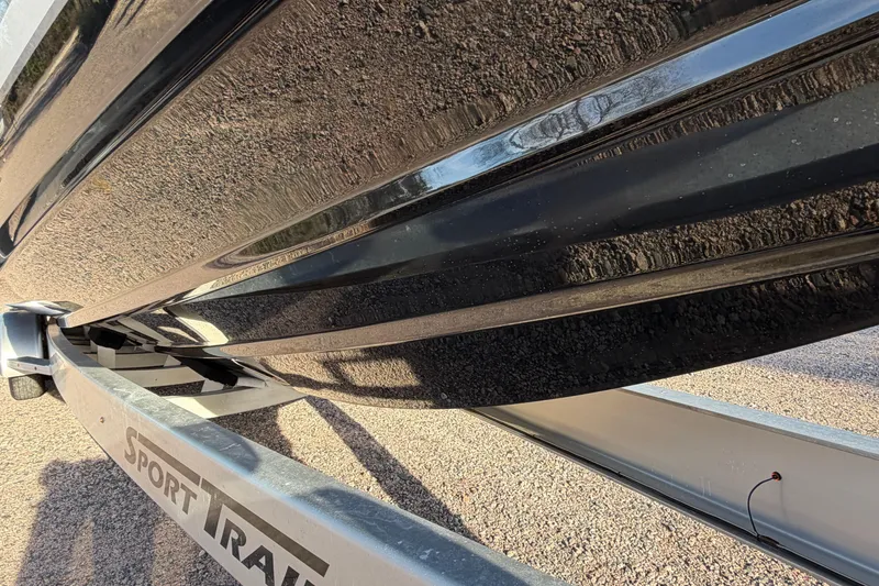 Slide: The Image of 2022 Nor-Tech 390 Sport Center Console on Sport Trail trailer, close-up view. - 10