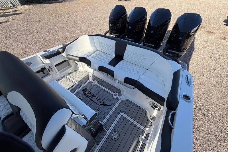 Slide: The Image of 2022 Nor-Tech 390 Sport Center Console with luxurious seating and powerful quad engines. - 17