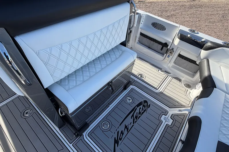Slide: The Image of Luxurious interior of 2022 Nor-Tech 390 Sport Center Console boat with diamond-stitched seating. - 19