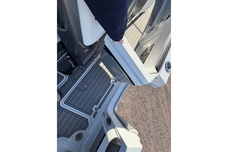 Slide: The Image of 2022 Nor-Tech 390 Sport Center Console boat interior with sleek deck design and modern features. - 22