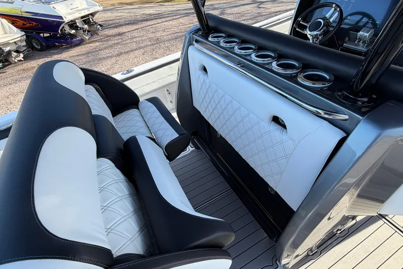 Slide: The Image of 2022 Nor-Tech 390 Sport Center Console with luxurious seating and sleek dashboard design. - 23