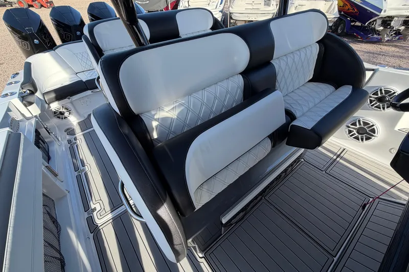 Slide: The Image of 2022 Nor-Tech 390 Sport Center Console with luxurious seating and modern design. - 27