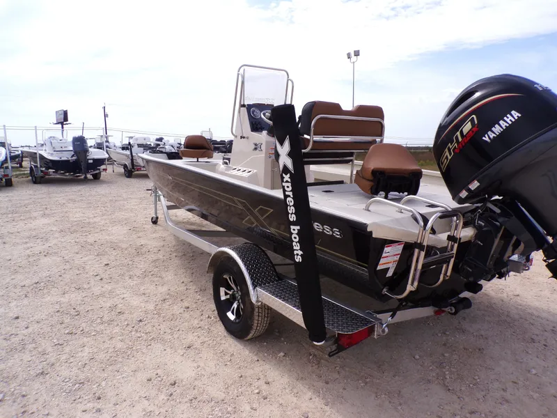 Slide: The Image of 2026 Xpress H20BAY boat with Yamaha motor on trailer. - 11