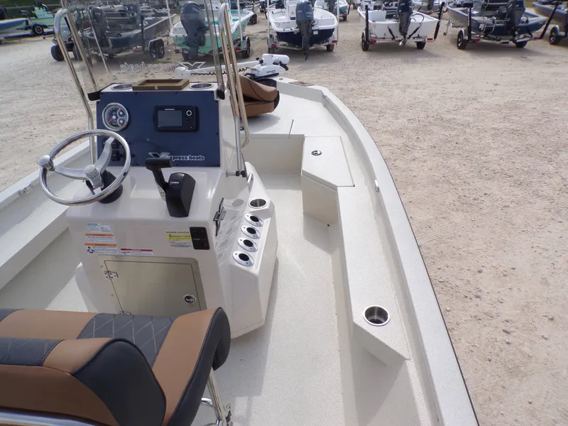Slide: The Image of 2026 Xpress H20BAY boat with steering console and seating area. - 12