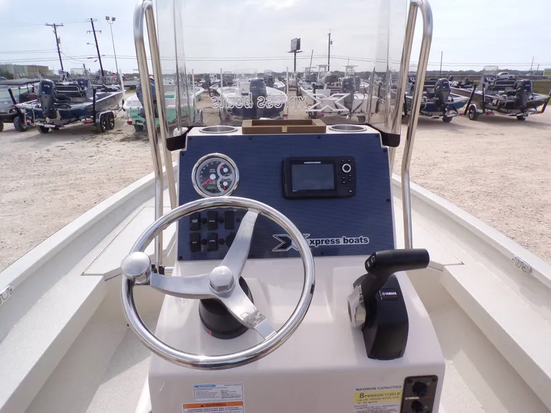 Slide: The Image of Xpress H20BAY boat console, 2026 model, displayed at a boatyard. - 14
