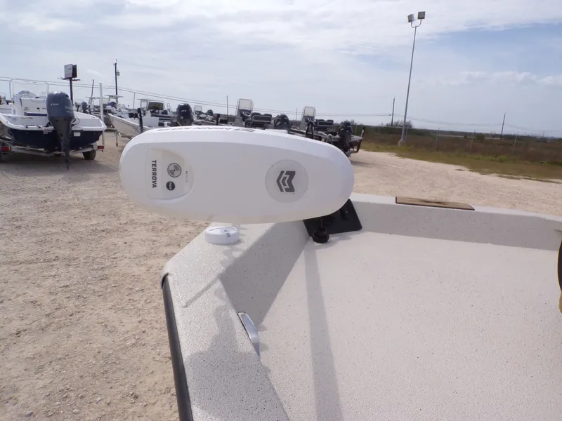 Slide: The Image of 2026 Xpress H20BAY boat with Terrova motor on gravel lot. - 16