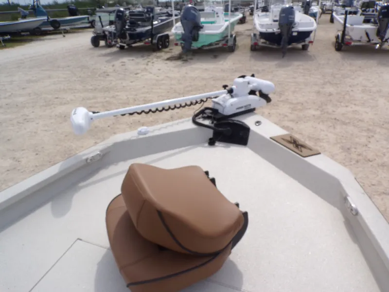 Slide: The Image of 2026 Xpress H20BAY boat with electric motor on sandy lot. - 17