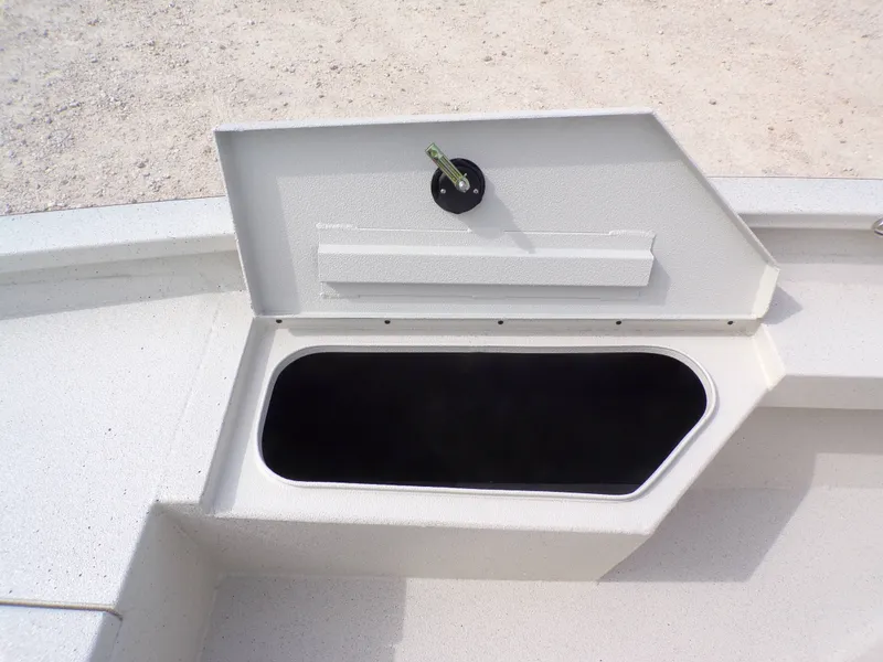 Slide: The Image of Open storage compartment on a 2026 Xpress H20BAY boat. - 19