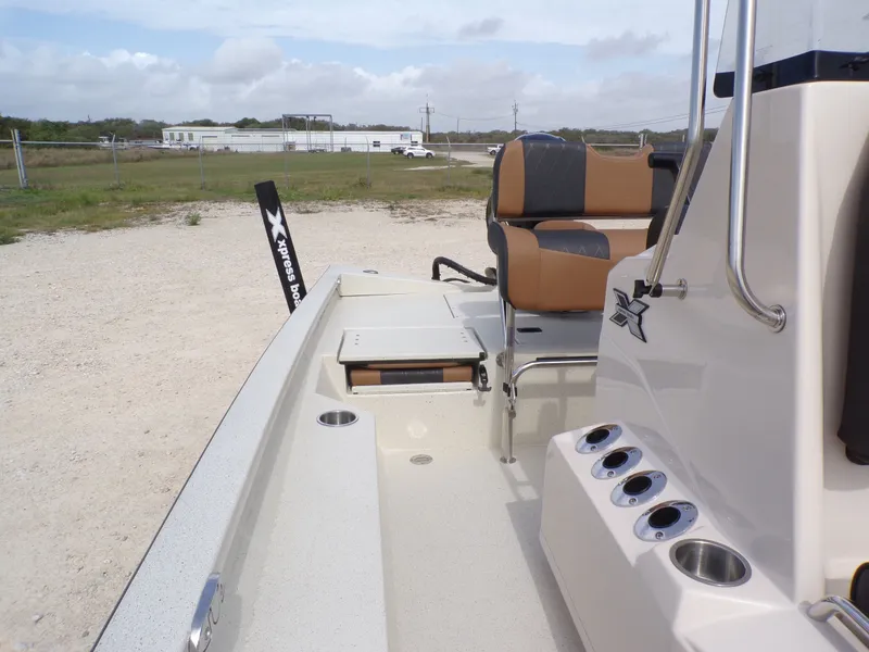 Slide: The Image of 2026 Xpress H20BAY boat interior with seating and console view. - 21