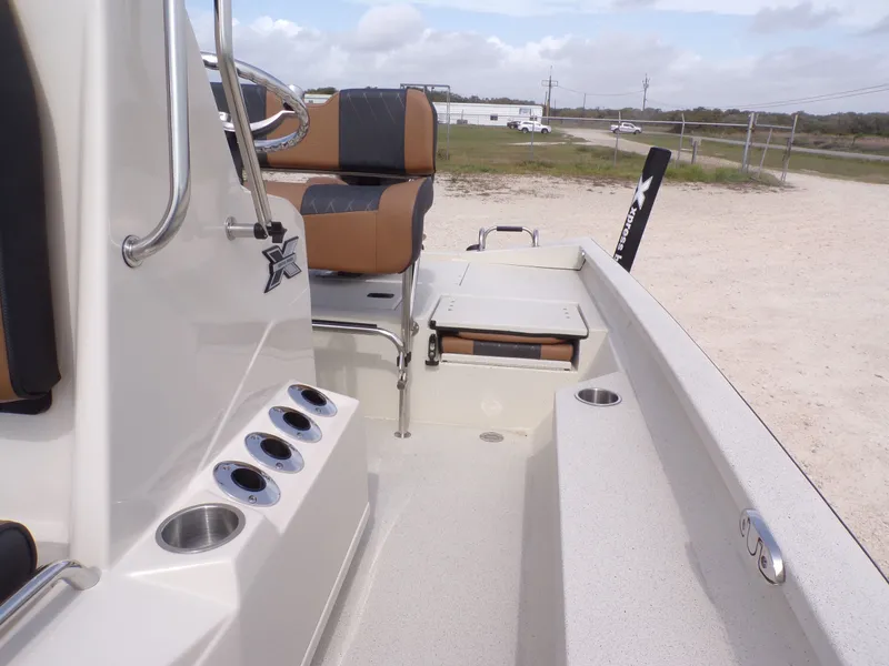 Slide: The Image of Interior view of 2026 Xpress H20BAY boat with seating and cup holders. - 22
