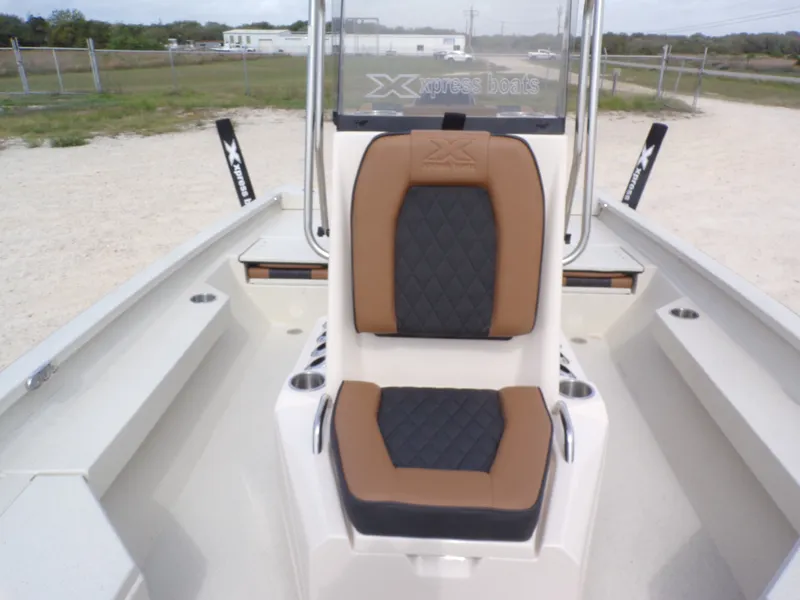 Slide: The Image of 2026 Xpress H20BAY boat with cushioned seat and modern design. - 23