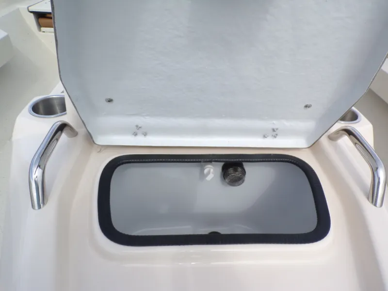 Slide: The Image of Open storage compartment lid on Xpress H20BAY boat, year 2026. - 24