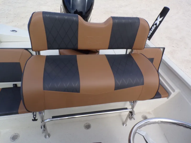 Slide: The Image of 2026 Xpress H20BAY boat seat with brown and black upholstery design. - 27