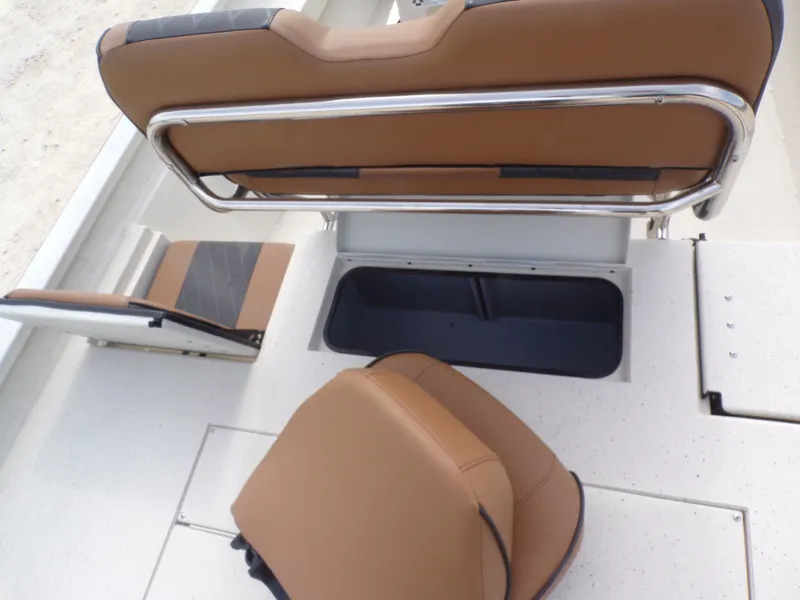 Slide: The Image of Interior of 2026 Xpress H20BAY with brown seats and storage compartment. - 28