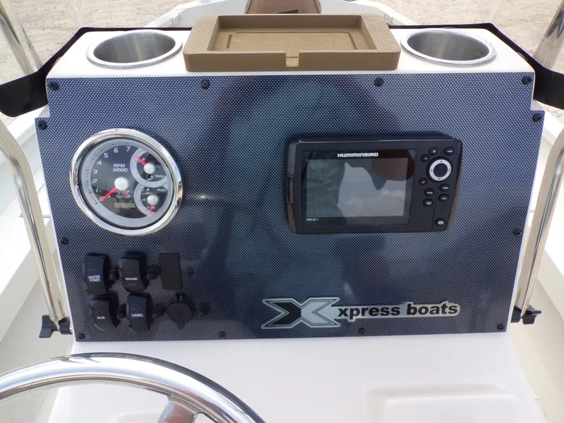 Slide: The Image of Dashboard of 2026 Xpress H20BAY with tachometer and Humminbird display. - 30